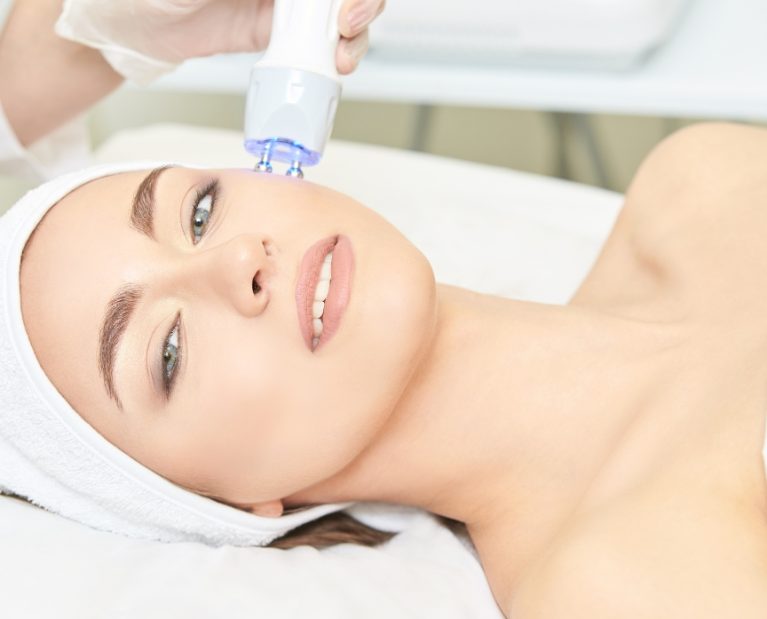 woman doing a Laser therapy